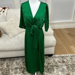 Gorgeous Kelly green satin dress with tie front and flattering pleating!